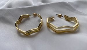 Golden waves earrings side view